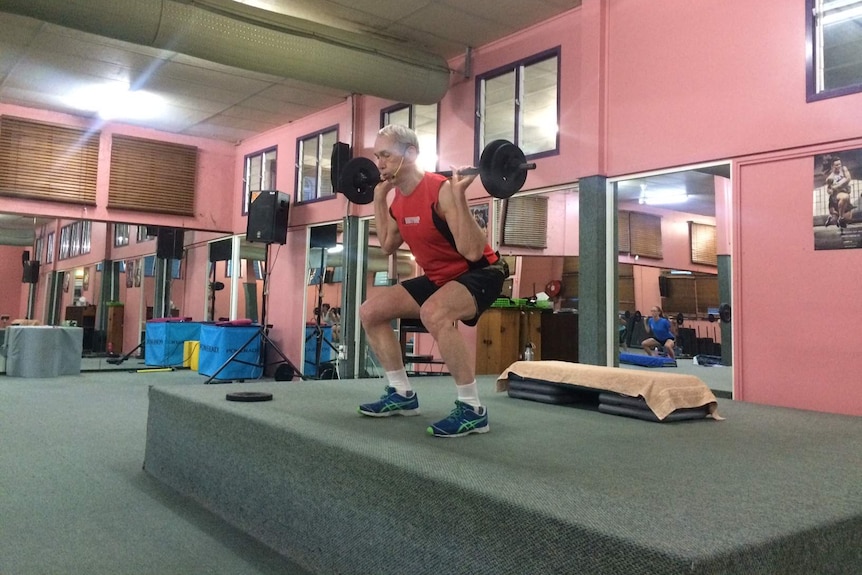 Body pump instructor Allan Johnson works out.