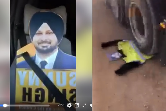 A screenshot of a video showing a man's election poster, and an effigy of the man underneath a truck's tyre. 