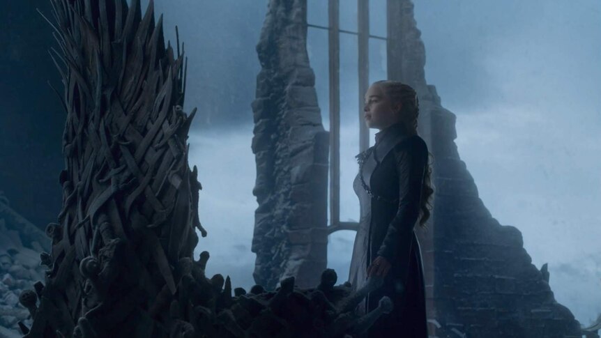 Daenerys touches the Iron Throne.