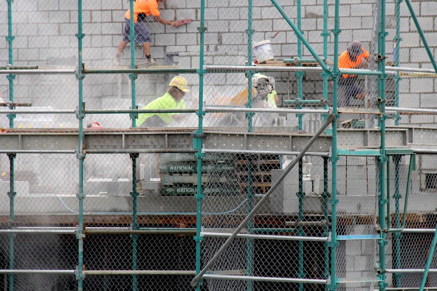 Workers on a residential construction site.