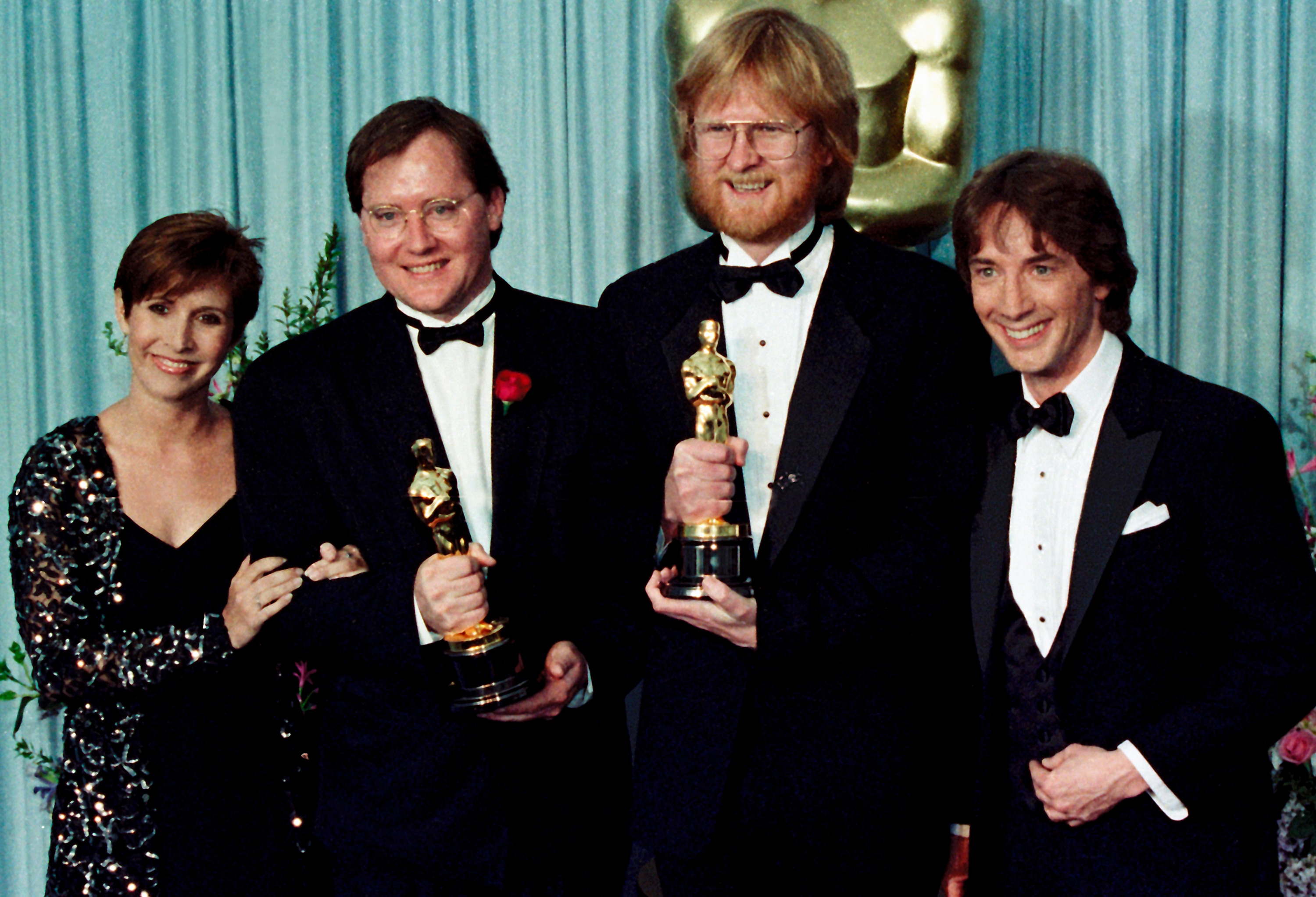 John Lasseter (second from left) with his Oscar for Tin Toy at the 1989 Academy Awards.
