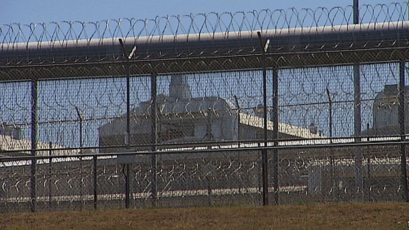 Razor wire surrounds Sir David Longland Correctional Facility in western Brisbane