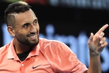 Nick Kyrgios points during a first-round Australian Open game.