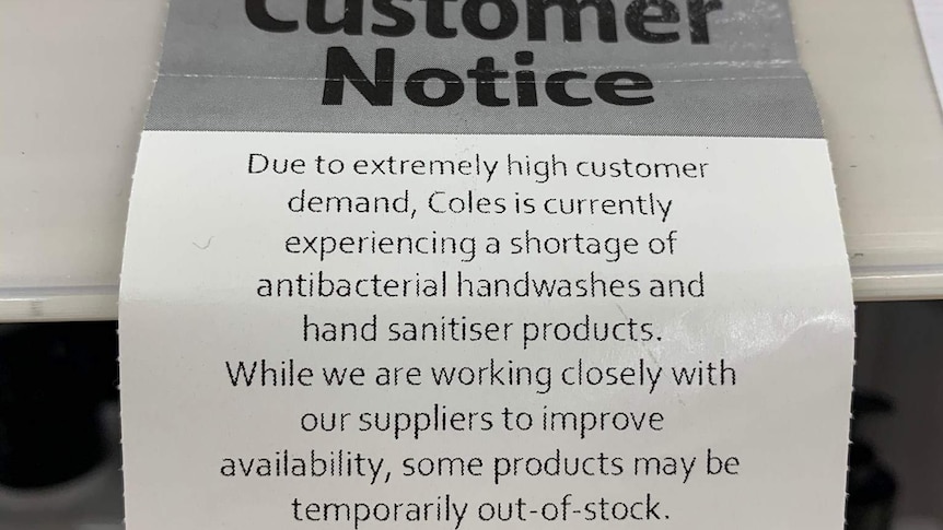 A notice in Coles supermarket saying there is a shortage of antibacterial and sanitiser products