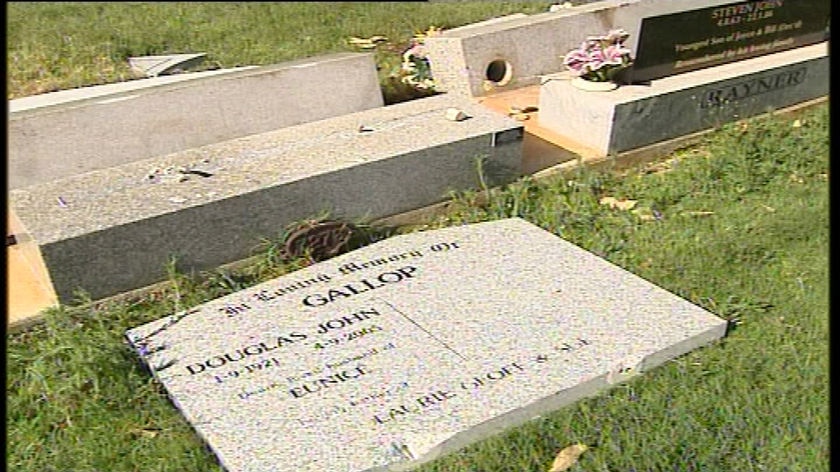 The damaged headstone of Douglas John Gallop