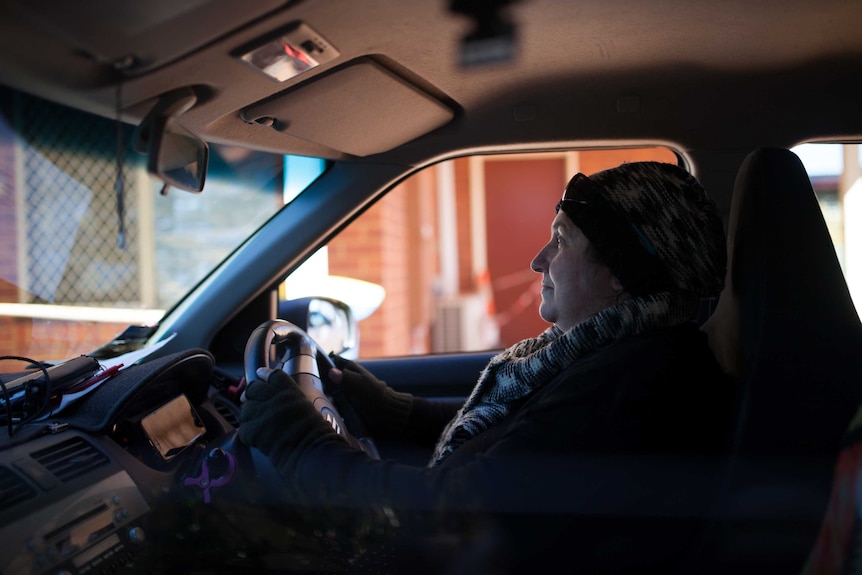 Cashless welfare card trial participant Sam Harding drives her car near her Kalgoorlie home.