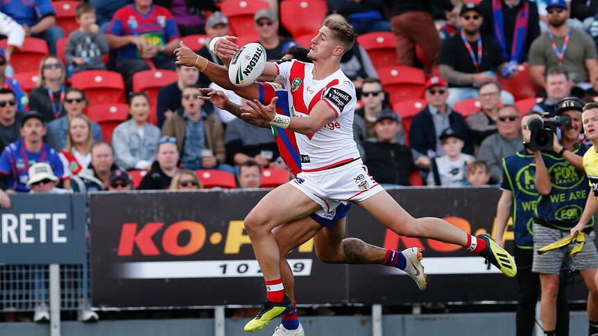 Zac Lomax gathers the ball but knocks on against the Knights.