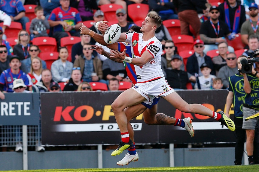 Zac Lomax gathers the ball but knocks on against the Knights.