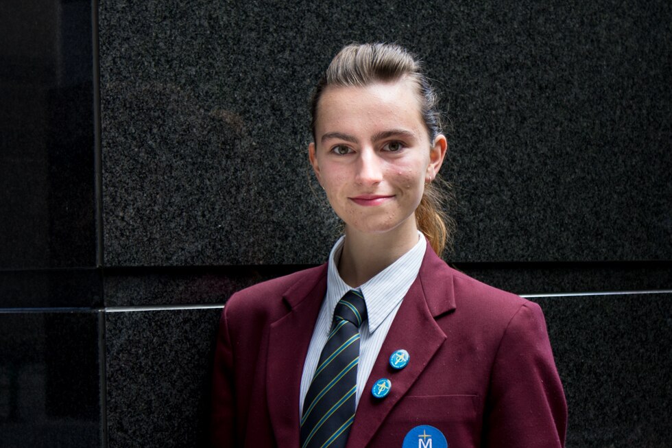 A teenage girl in school uniform