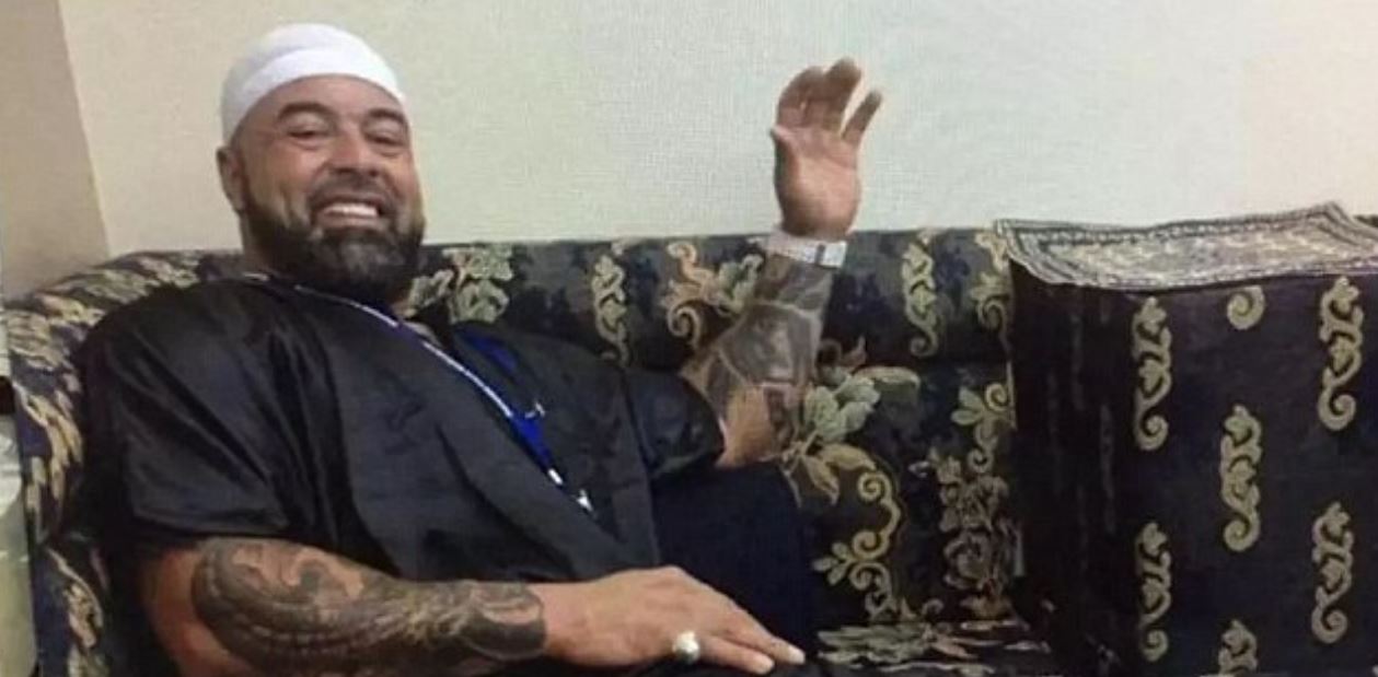 a man sitting and waving