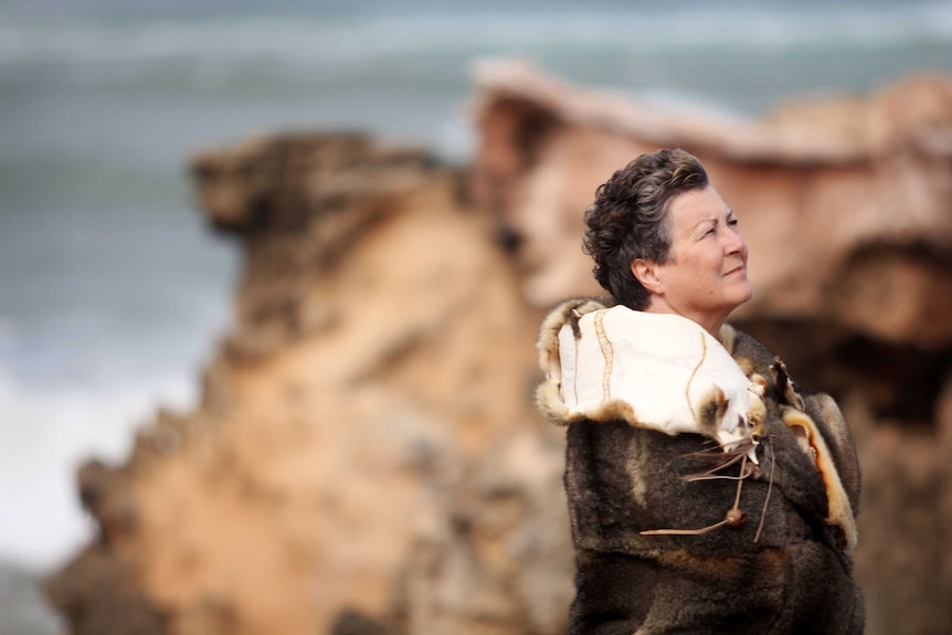 Michelle wearing cloak on Shelley Beach.