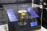 An asteroid explorer model in a glass display
