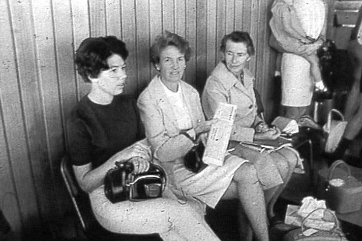 A black and white photo of three women in 1973.