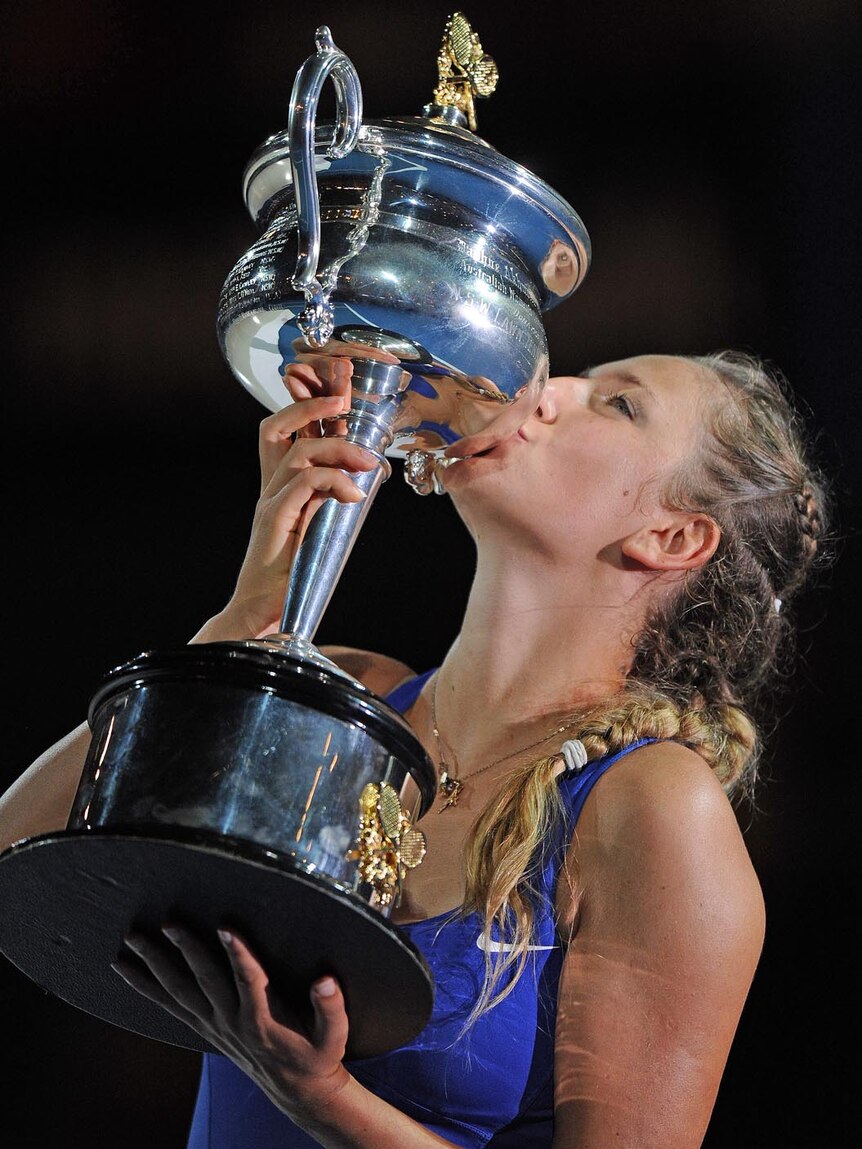 Victoria Azarenka kisses the winner's trophy after her victory over Maria Sharapova.
