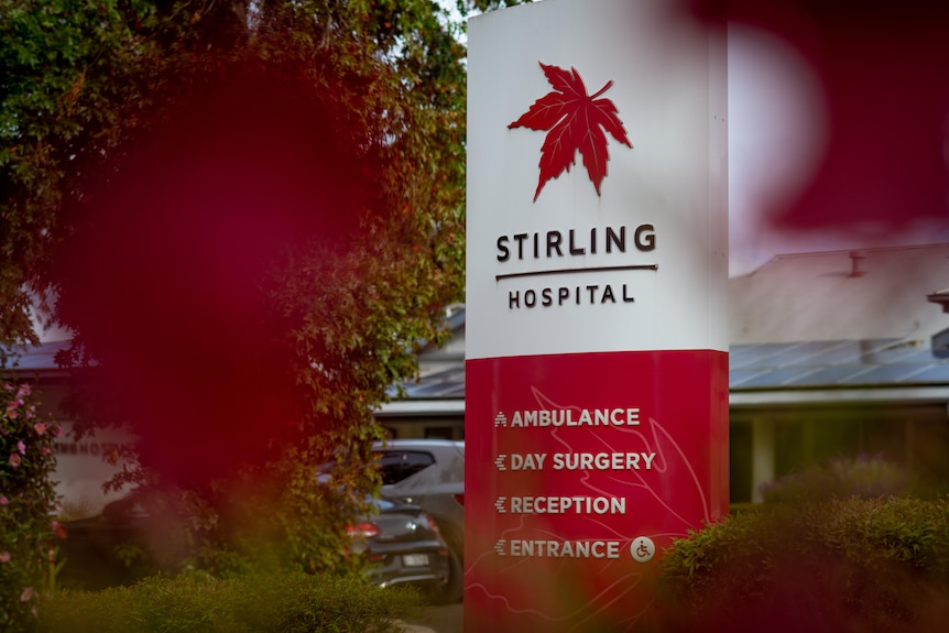 A red and white sign with a red maple leaf above the words 'Stirling Hospital'