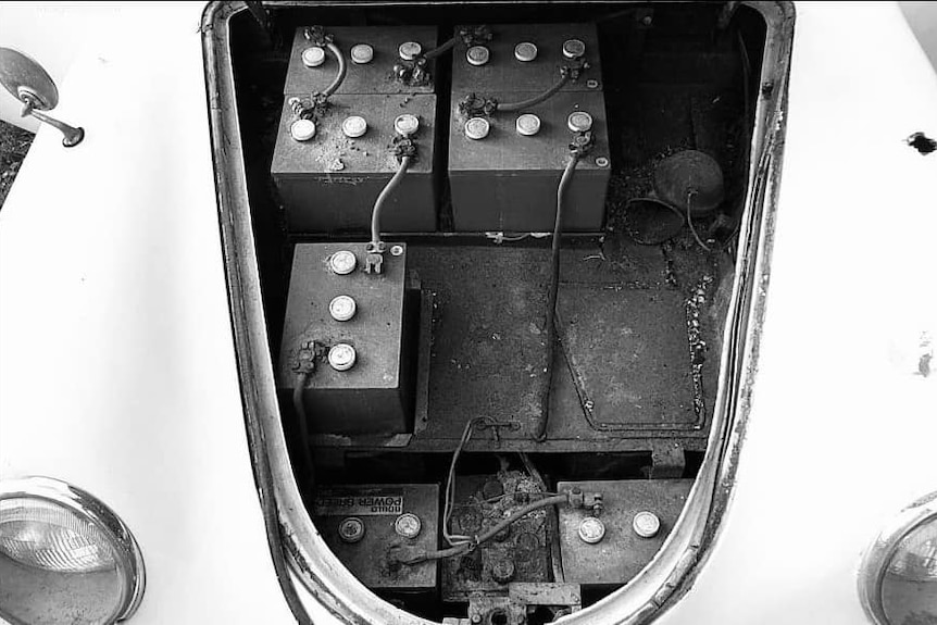 The lead-acid batteries in the trunk of the Porsche