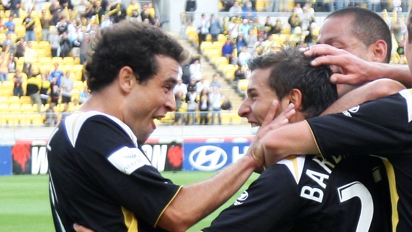 Daniel and Barbarouses celebrate the equaliser against Adelaide United