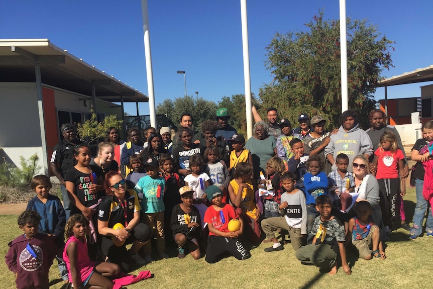 Wiluna Remote Community School students and teachers in front of their classrooms