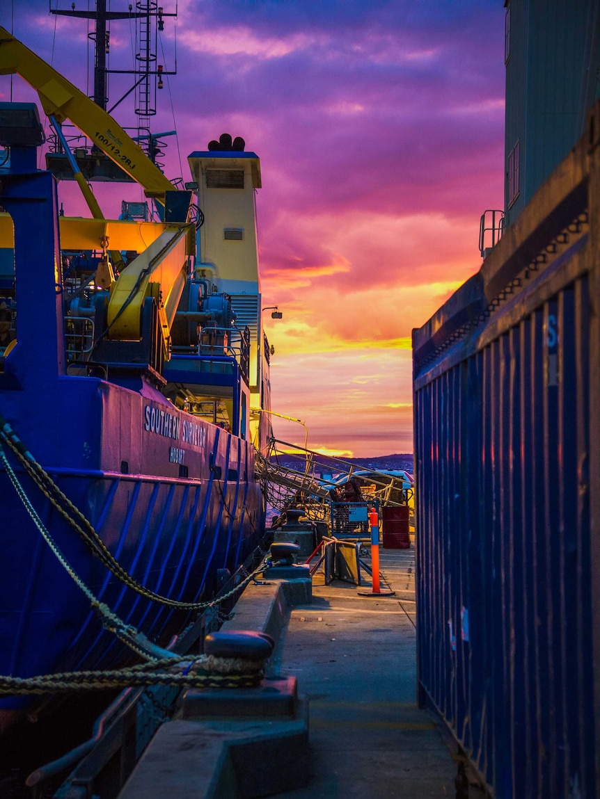 Purple, pink and orange clouds over the Aurora Australis icebreaker ship
