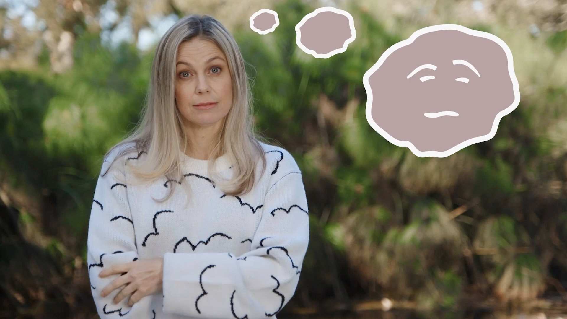 Rachael Coopes, from the show Moodies, with thought bubbles with a sad face on them.