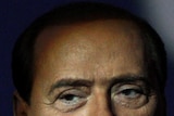 Italy's Prime Minister Silvio Berlusconi looks on before the taping of a TV show