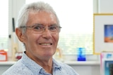Patient Clive Couperthwaite, who has Parkinson's disease, sits in a doctor's office in Brisbane