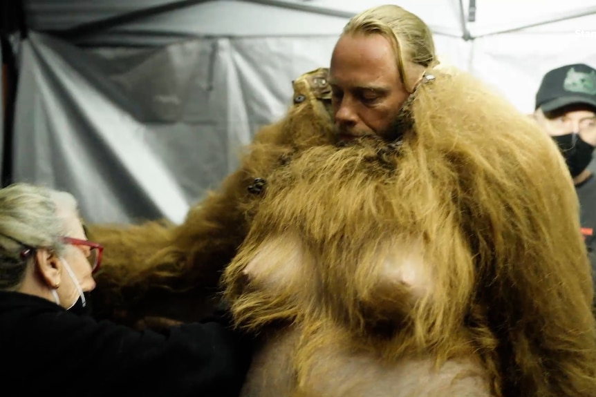 Andrew Crawford wears the pregnant wolf suit in Wolf Like Me.