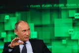 Russian President Vladimir Putin speaks during a visit to Russia Today in Moscow.