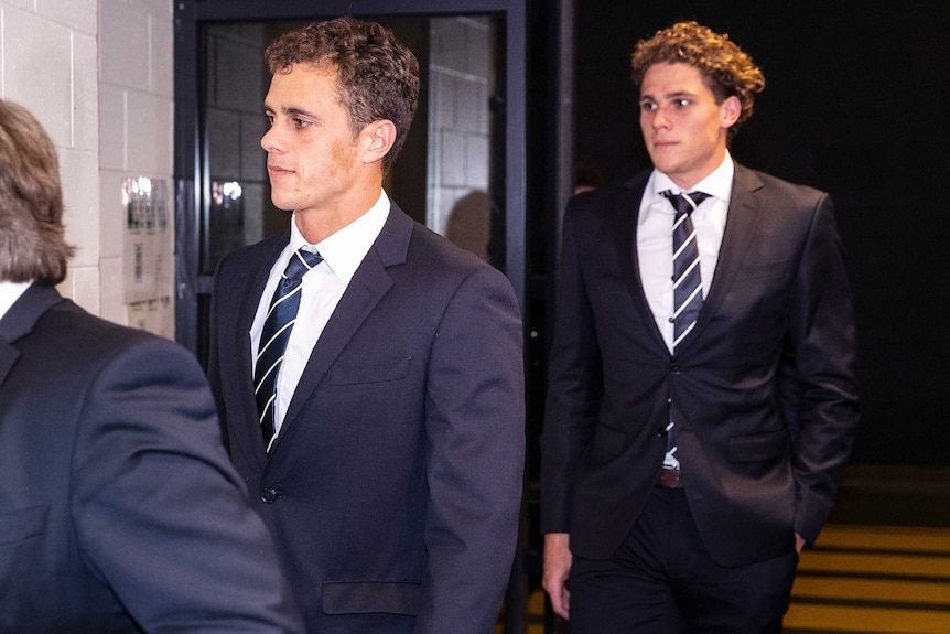 Ed and Charlie Curnow arrive at the AFL tribunal