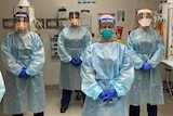 Six nurses wearing personal protective equipment.