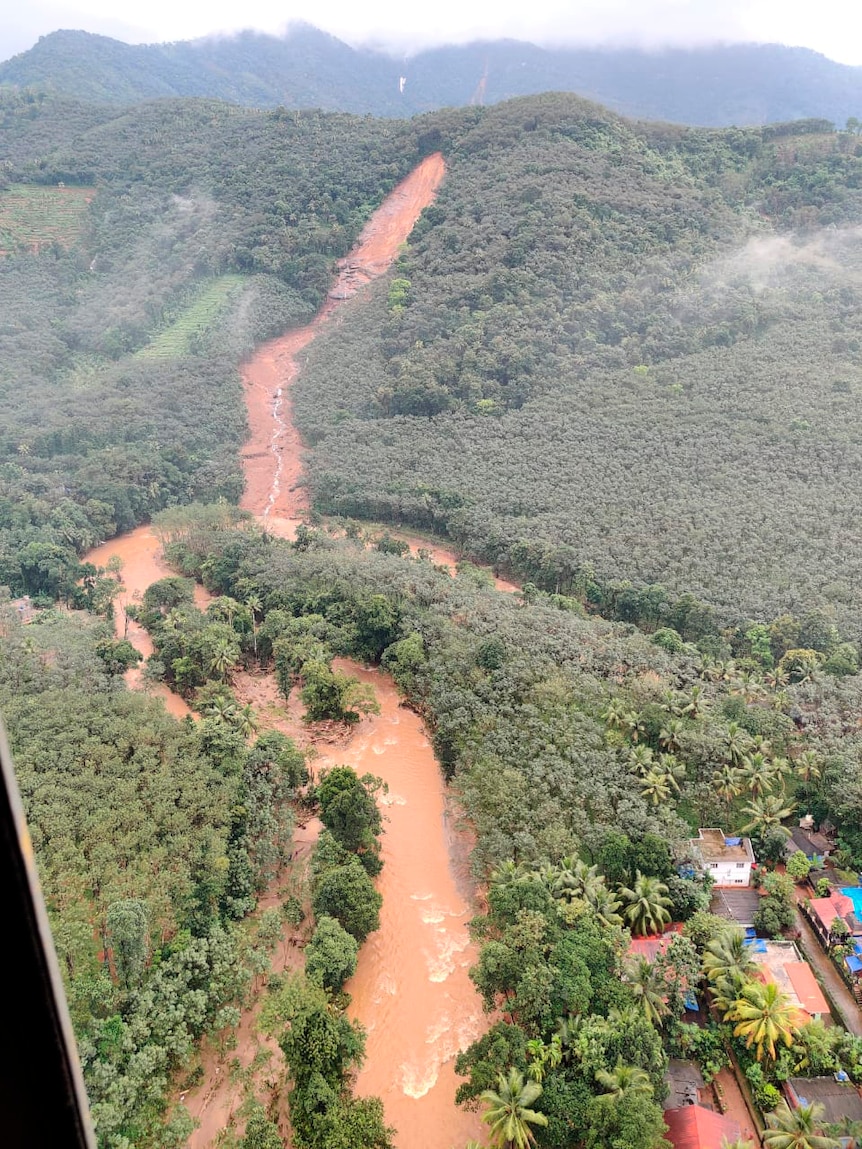 An aerial view from a naval helicopter shows the scene after a landslide rolled down the western ghats mountains in Kerala.