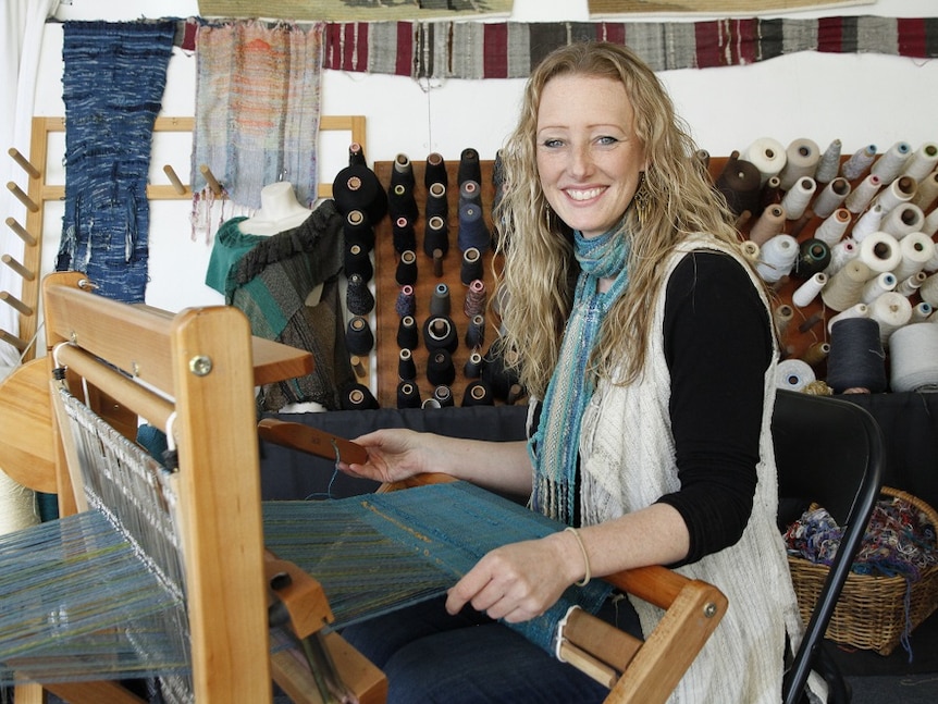Prue Simmons weaving textiles  on a loom