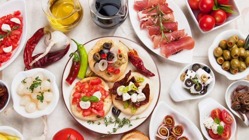 A table full of tapas plates.