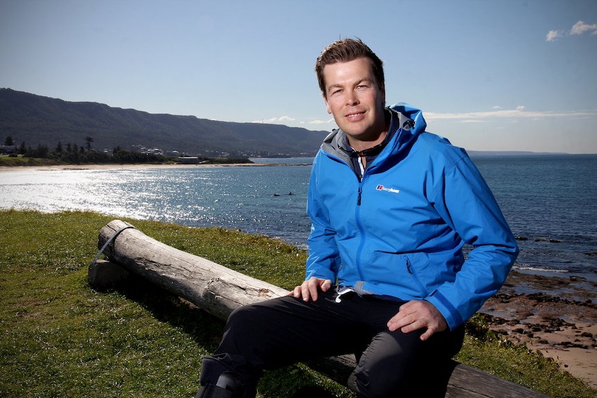 Corey Pearson sits on a bench at Bulli Beach point.