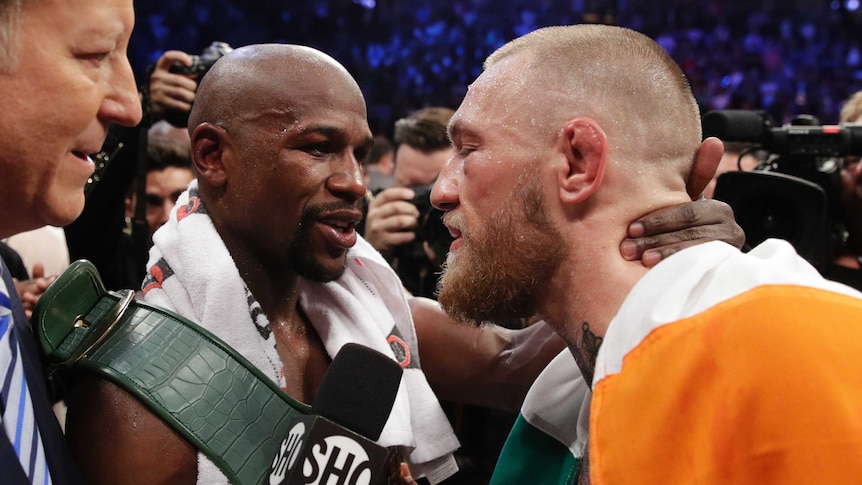 Floyd Mayweather and Conor McGregor embrace after their fight