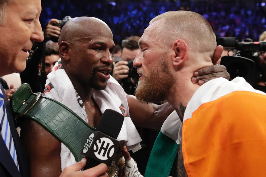 Floyd Mayweather and Conor McGregor embrace after their fight