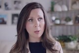 A woman talks with a concerned look on her face in the No campaign's television ad.