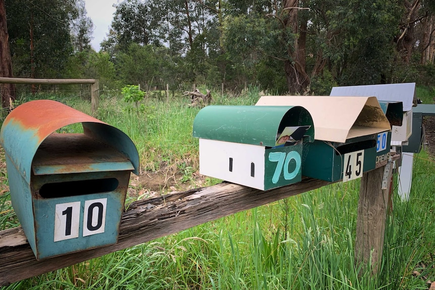 Four post boxes at on a rural road in Victoria.