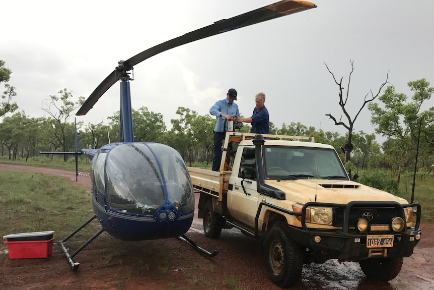 A car and a helicopter parked in bush in the remote north Kimberley