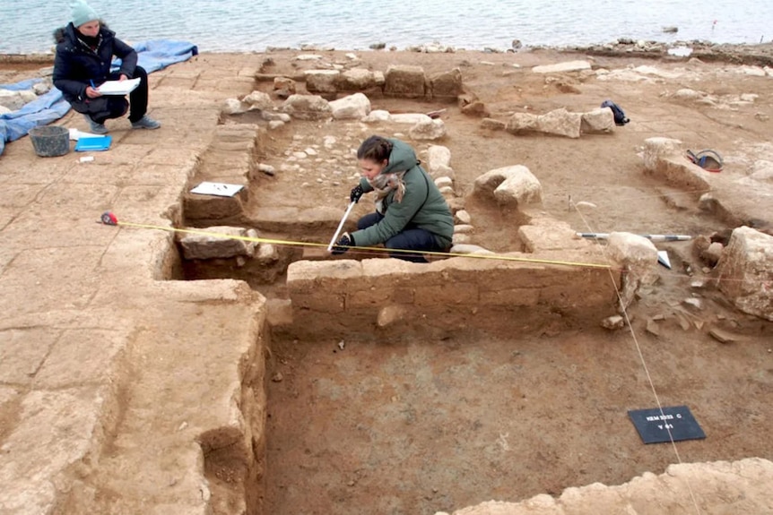 Excavated buildings are measured and archaeologically documented from Mosul Dam in Iraq.