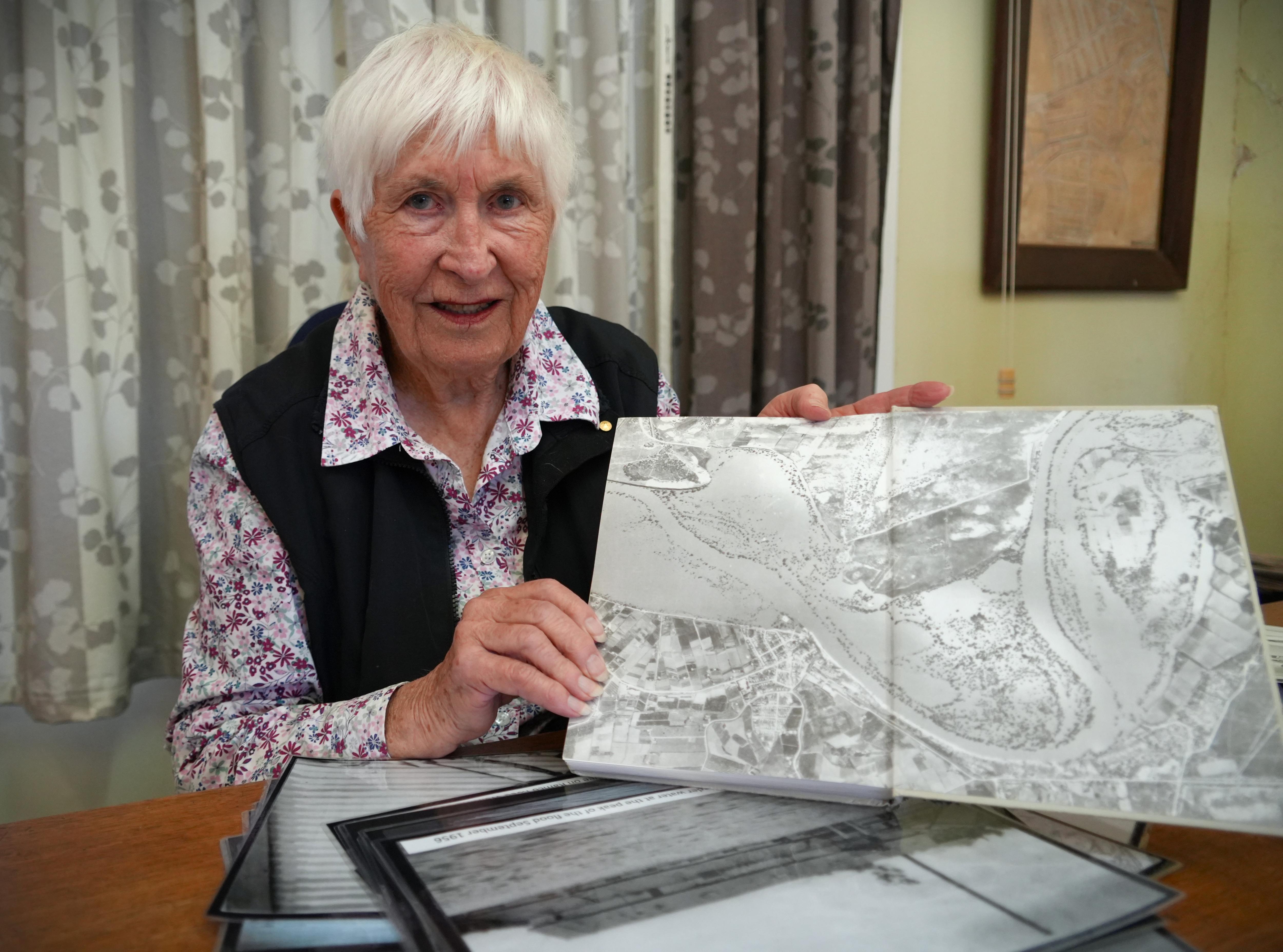 a woman holds a photo