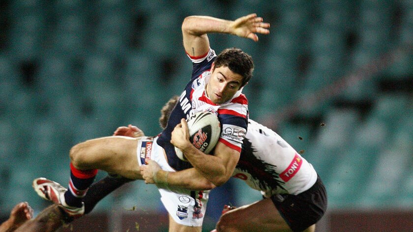 Flying: Minichiello made good ground and scored a try.