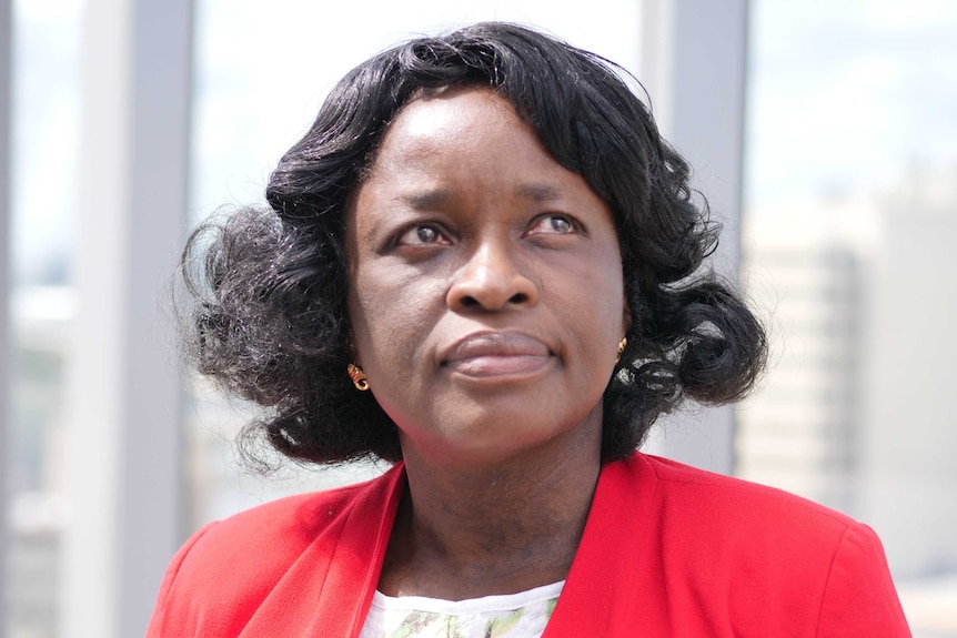 Dr Olayide Ogunsiji stands in the sun at the Western Sydney University Liverpool campus.