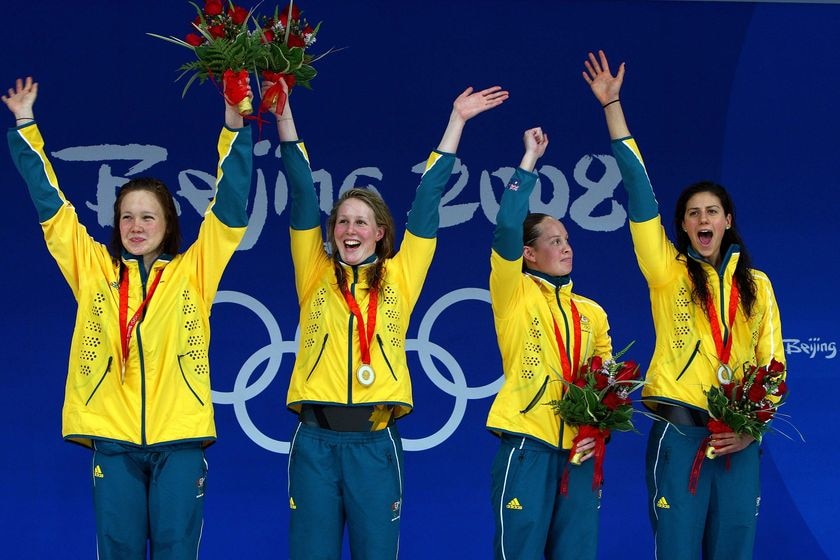 Kylie Palmer, Bronte Barratt, Linda Mackenzie and Stephanie Rice wave to the crowd