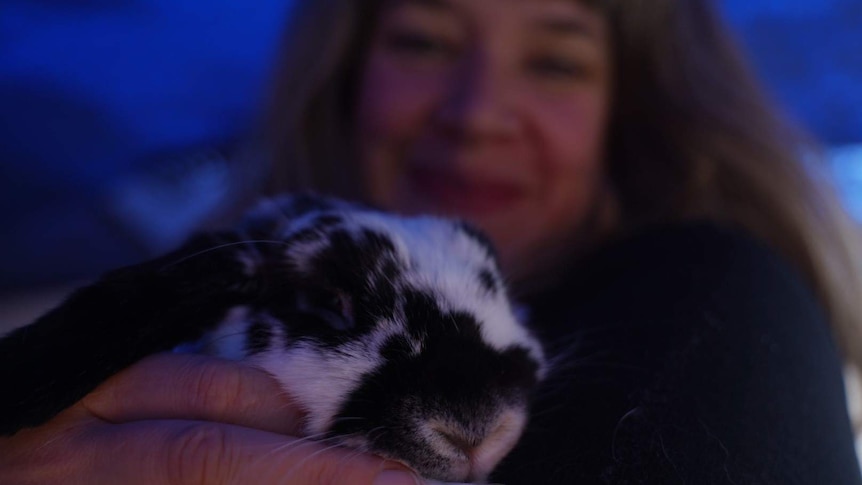 Kate the life long renter cuddle her rabbit, May 2019, Tasmania.