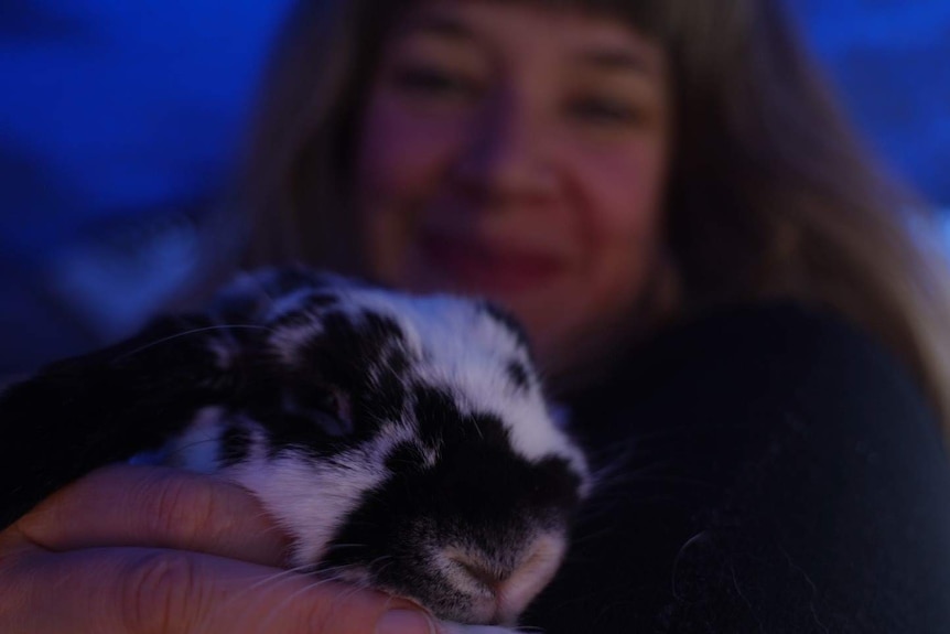 Kate the life long renter cuddle her rabbit, May 2019, Tasmania.