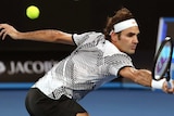 Roger Federer makes a backhand return against Stan Wawrinka during their semi-final