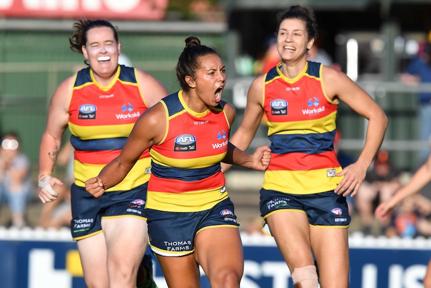 Ruth Wallace of the Crows (C) celebrates a goal against Carlton at Norwood Oval.