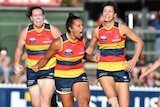 Ruth Wallace of the Crows (C) celebrates a goal against Carlton in the AFLW at Norwood Oval.