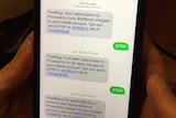 A screenshot of a mobile phone showing a premium text message and someone replying "STOP"